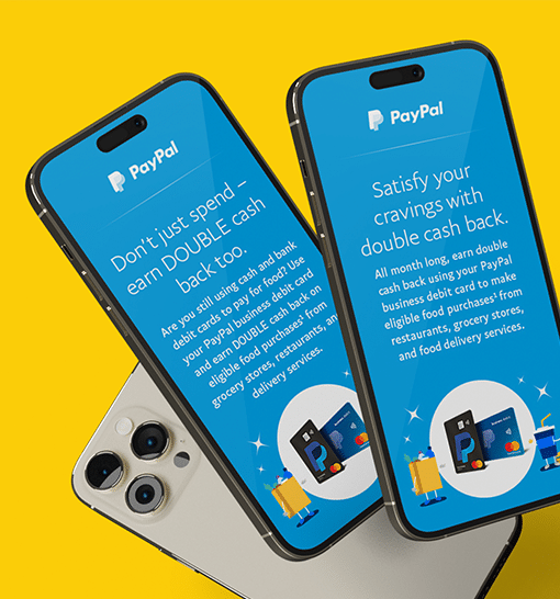 Three phones against a yellow background. Two of the phones show an ad for PayPal's debit card offer